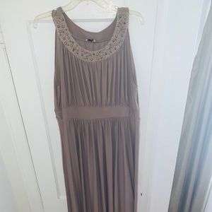 Neutral/Natural gown with empire waist.